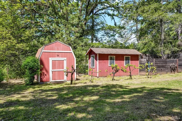 a front view of house with yard and seating area