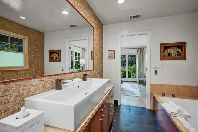 a view of bathroom with dual sinks