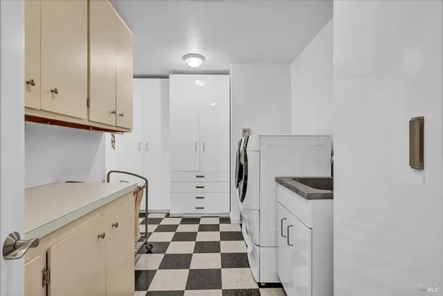 a kitchen with a sink and a refrigerator