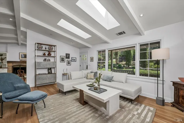 a living room with furniture and a table