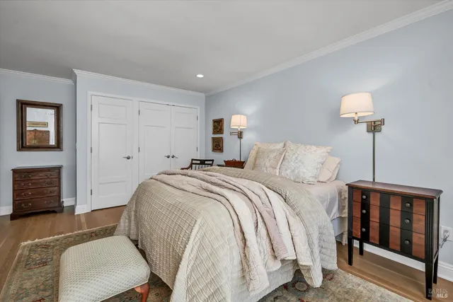 a bedroom with a bed and a lamp