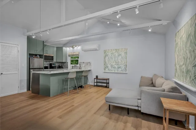a kitchen with a refrigerator and a sink