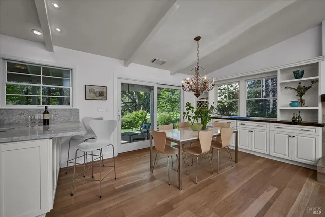 a kitchen with center island and windows