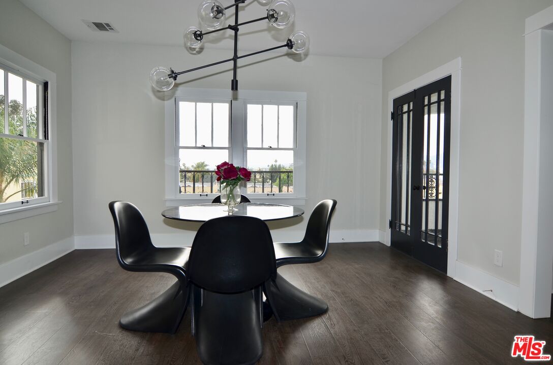 856 Serrano Place Los Angeles, CA 90029 - Photo 11 of 11 a view of a dining room with furniture window and outside view