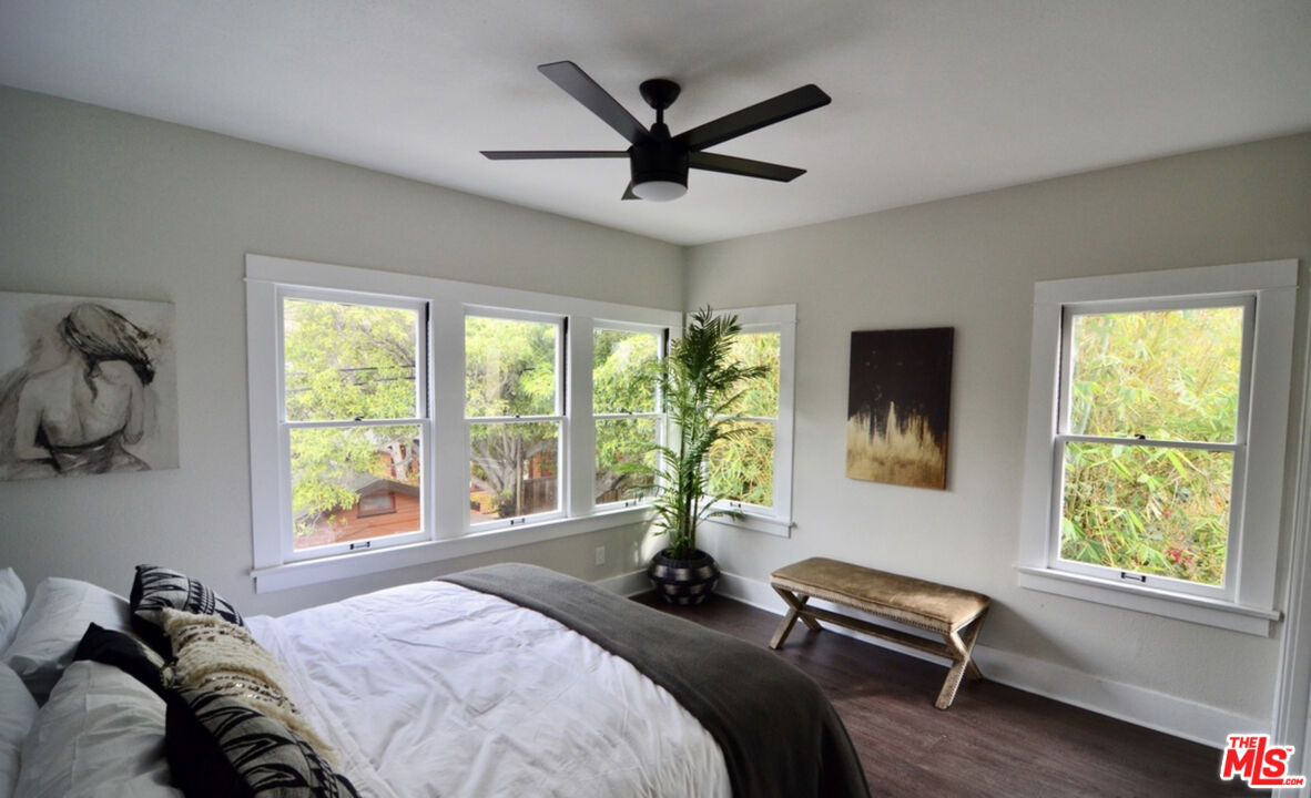 856 Serrano Place Los Angeles, CA 90029 - Photo 8 of 11 a bedroom with a bed and a large window