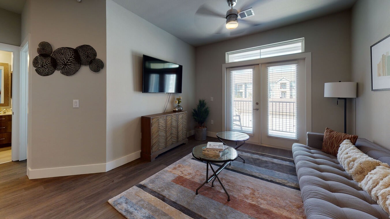 24002 Colonial Parkway, Unit 4329 Katy, TX 77493 - Photo 2 of 31 a living room with furniture and a chandelier
