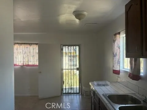 a view of a chairs and table in the backyard