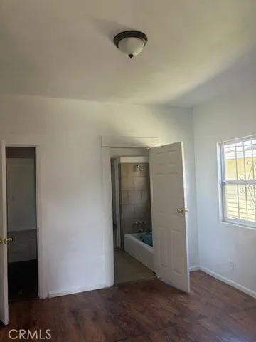 a room with water heater and view kitchen