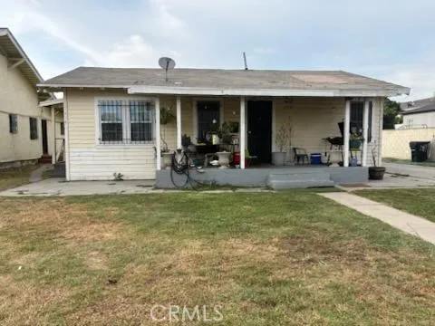 a front view of house with outdoor seating