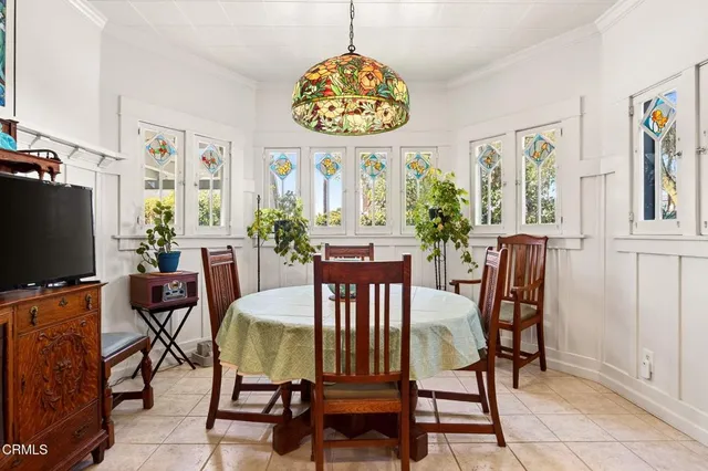 a kitchen with a table and chairs