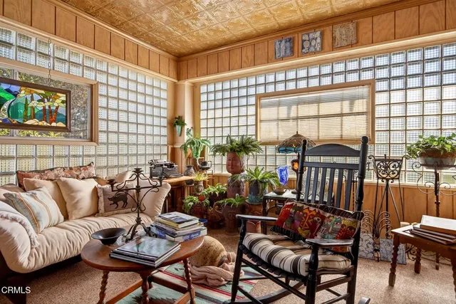 a front view of a dining room with furniture window and wooden floor