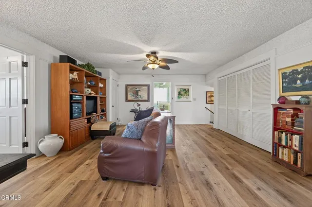 a bedroom with furniture and wooden floor