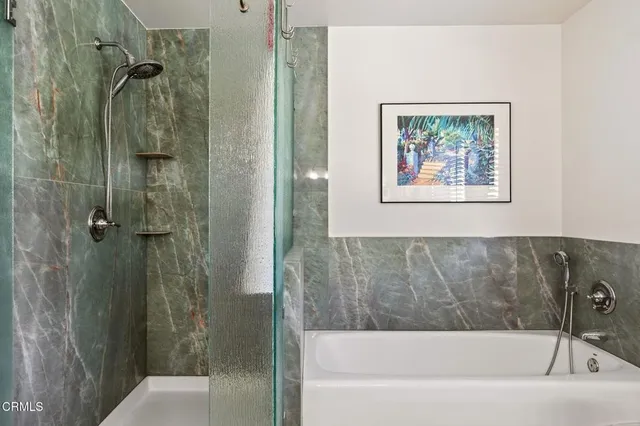 a bathroom with a sink mirror and vanity