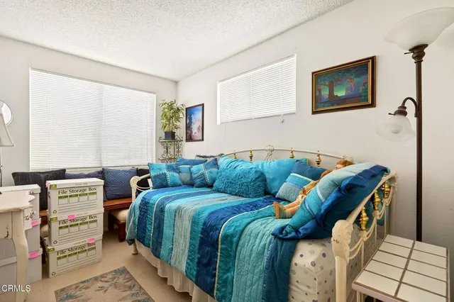 a bathroom with a sink vanity mirror and toilet