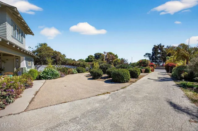 a view of a street with a building in the background