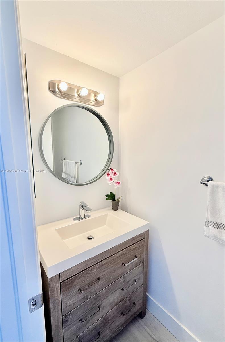 1800 Sunset Harbour Drive, Unit 2005 Miami Beach, FL 33139 - Photo 11 of 27 a bathroom with a sink and a mirror