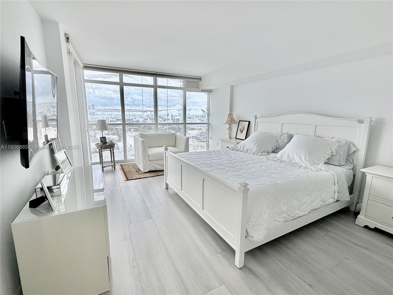 1800 Sunset Harbour Drive, Unit 2005 Miami Beach, FL 33139 - Photo 14 of 27 a living room with furniture and a large window