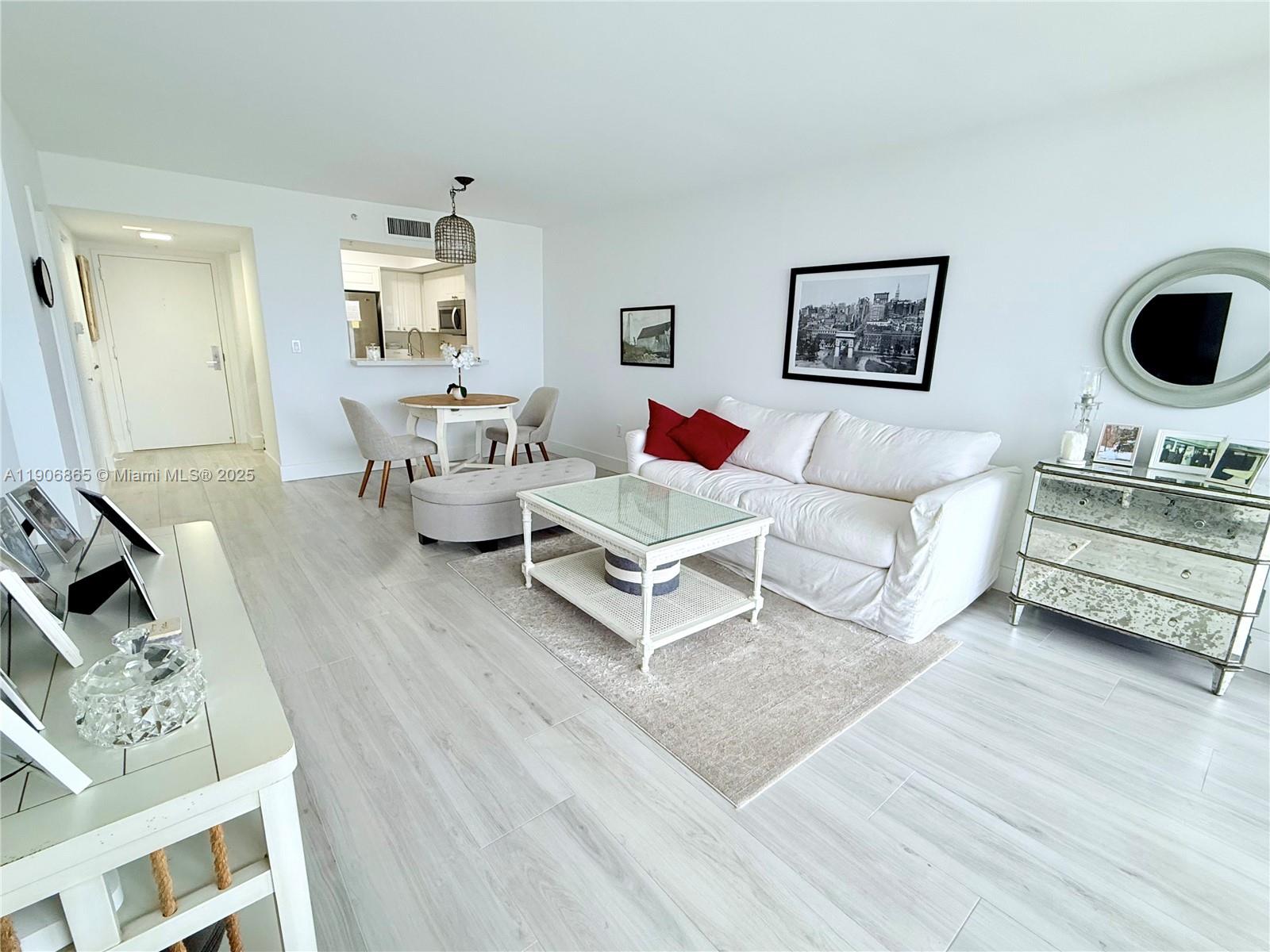 1800 Sunset Harbour Drive, Unit 2005 Miami Beach, FL 33139 - Photo 4 of 27 a living room with furniture and wooden floor