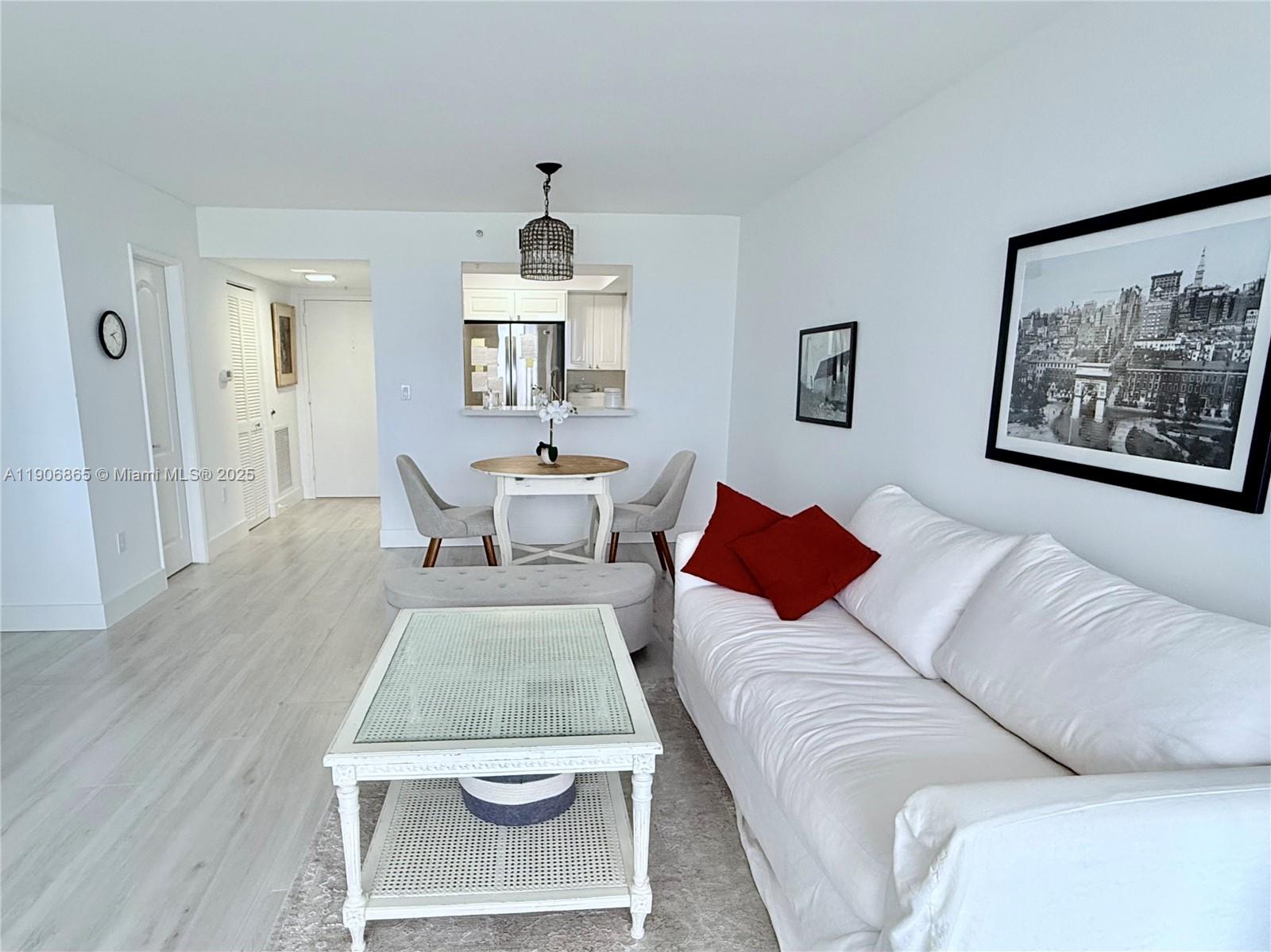 1800 Sunset Harbour Drive, Unit 2005 Miami Beach, FL 33139 - Photo 5 of 27 a living room with furniture and a wooden floor