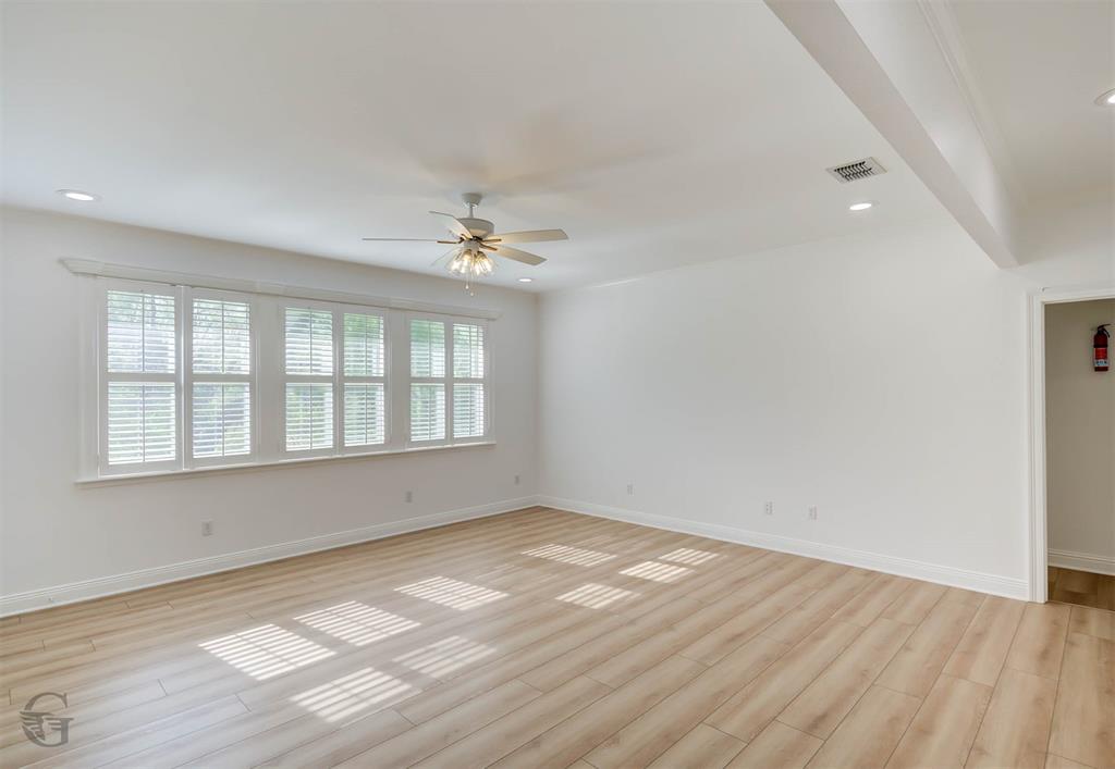 316 Autumn Ridge Drive Bossier City, LA 71111 - Photo 26 of 40 wooden floor in an empty room with a window