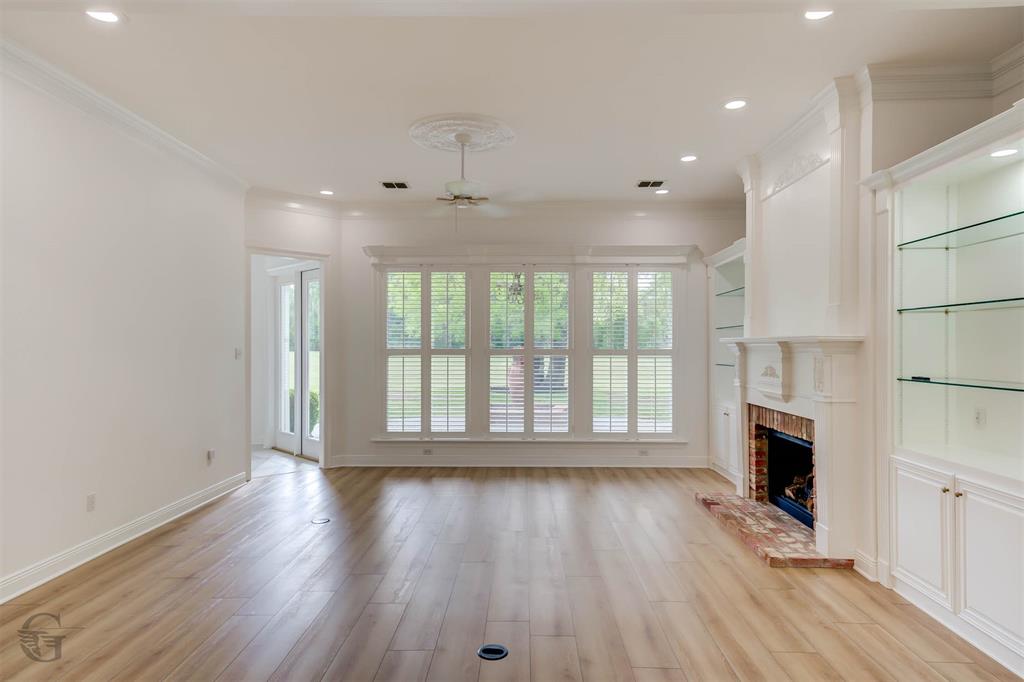 316 Autumn Ridge Drive Bossier City, LA 71111 - Photo 5 of 40 a view of an empty room with wooden floor and a window