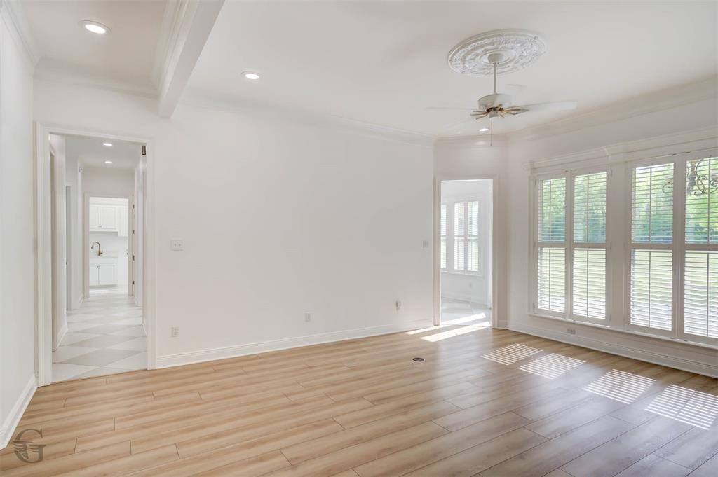 316 Autumn Ridge Drive Bossier City, LA 71111 - Photo 6 of 40 a view of an empty room with wooden floor and a window