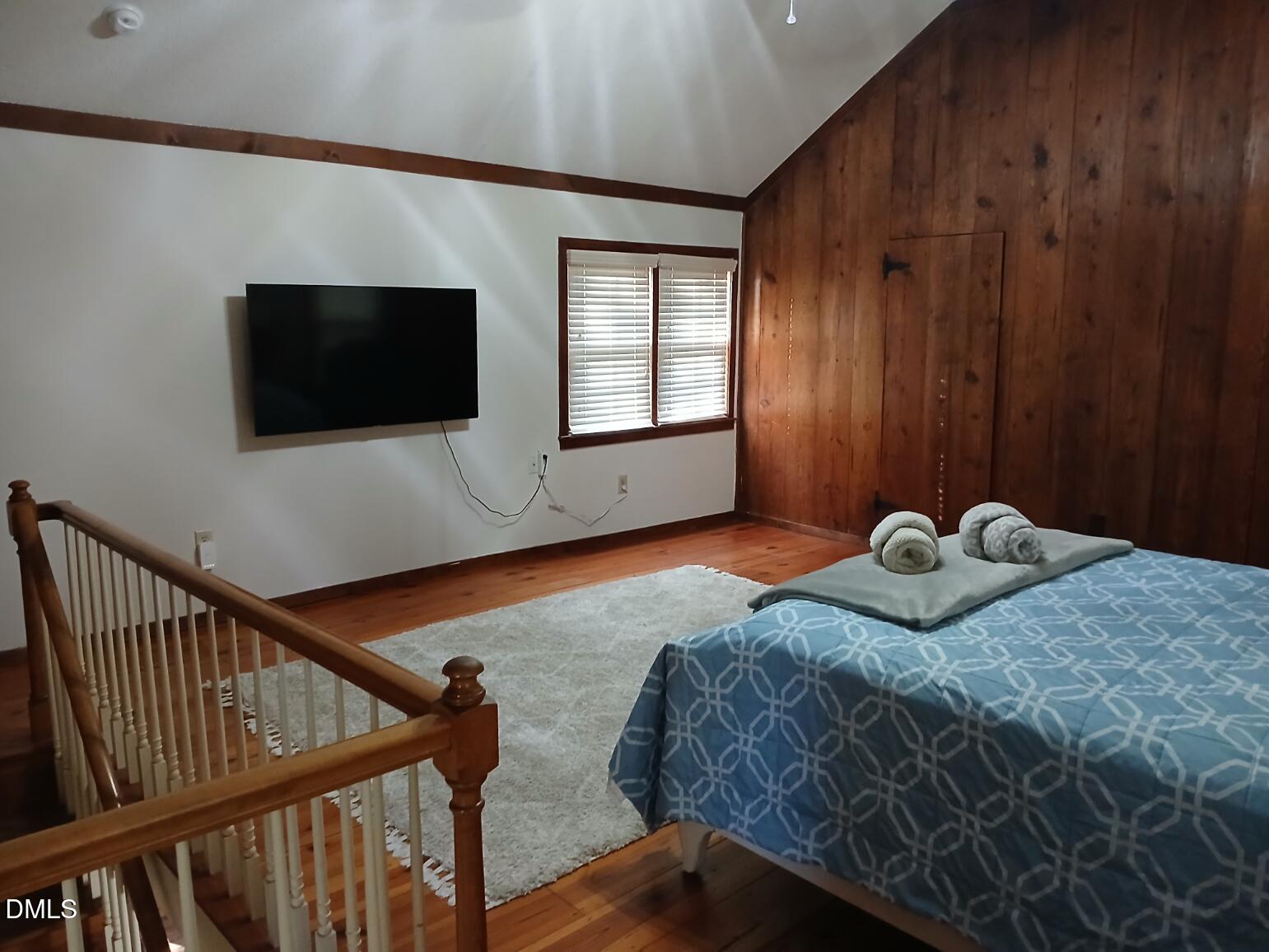 1920 Kelly Road Apex, NC 27502 - Photo 40 of 44 a bedroom with a bed and a flat screen tv