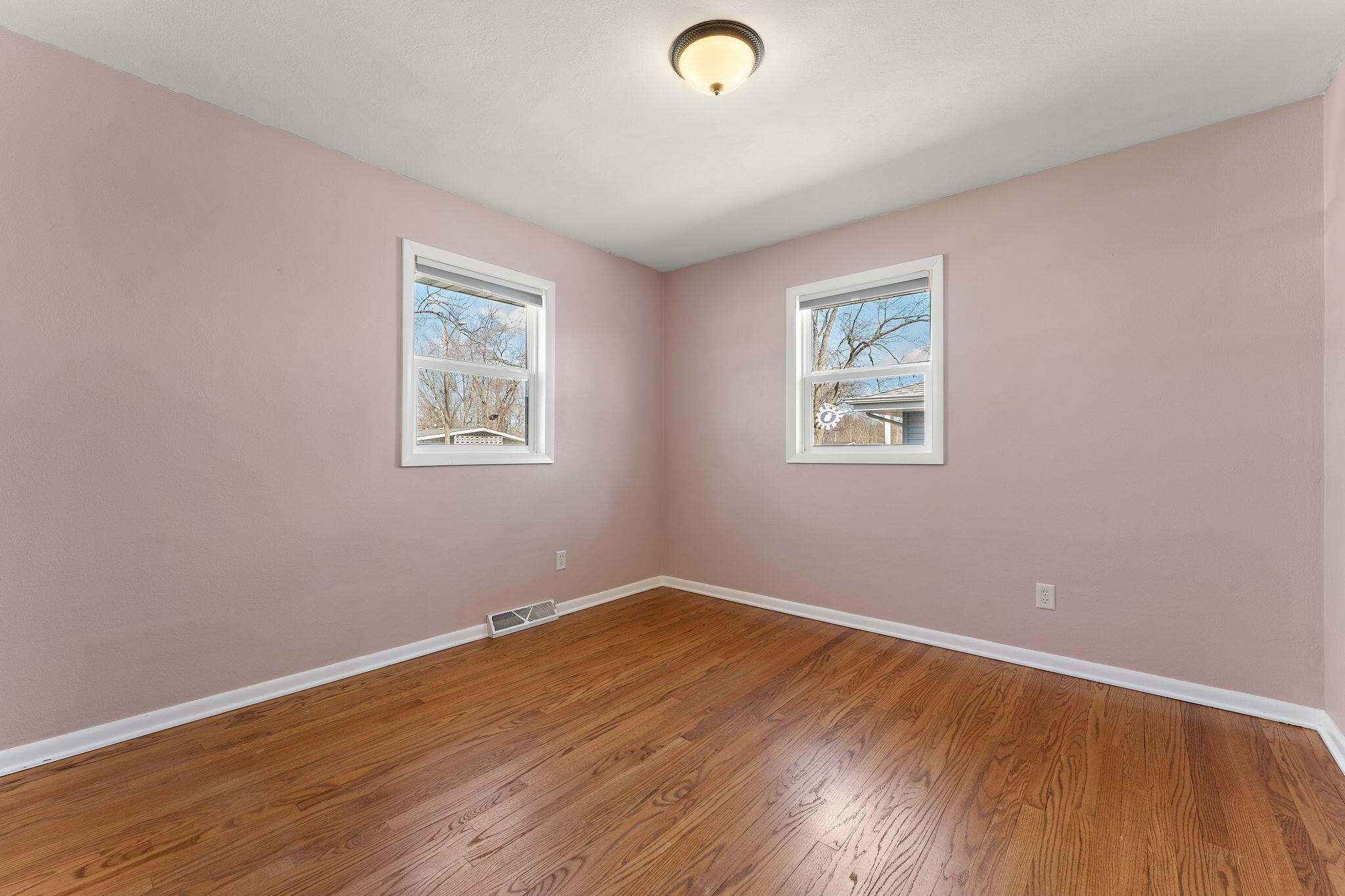 947 North Wood Street Griffith, IN 46319 - Photo 15 of 25 an empty room with wooden floor and windows