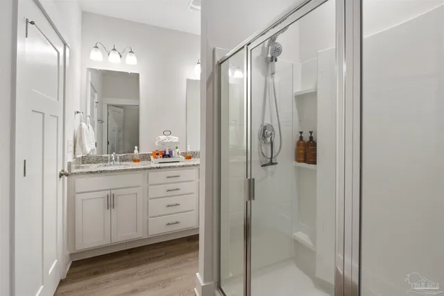 a bathroom with a double vanity sink and mirror