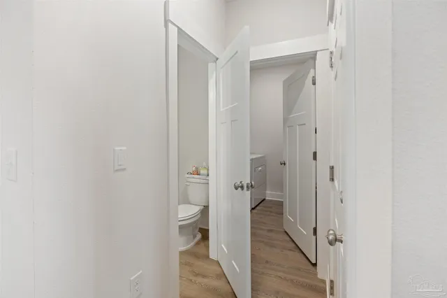 a bathroom with a granite countertop toilet