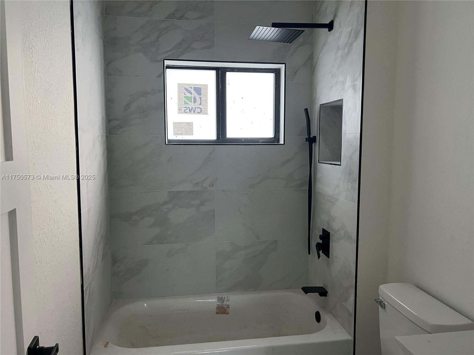 1735 Northwest 84th Street Miami, FL 33147 - Photo 11 of 14 a bathroom with a bathtub