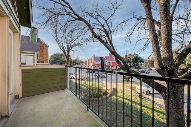 9815 Walnut Street, Unit 212 Dallas, TX 75243 - Photo 9 of 10 Private balcony with concrete flooring, green horizontal siding, and a black metal railing