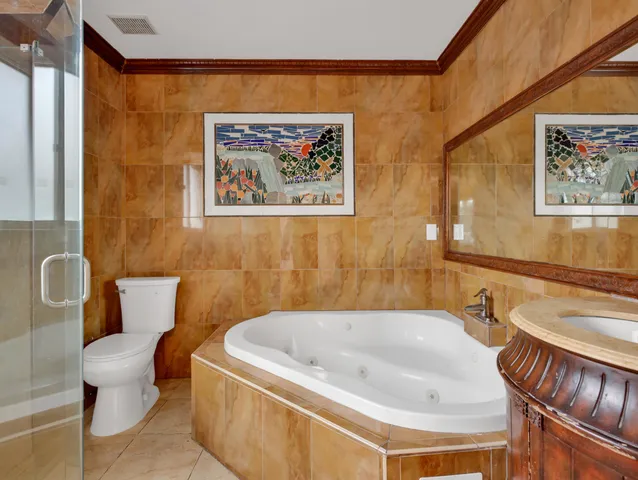 a bathroom with a toilet and a bathtub