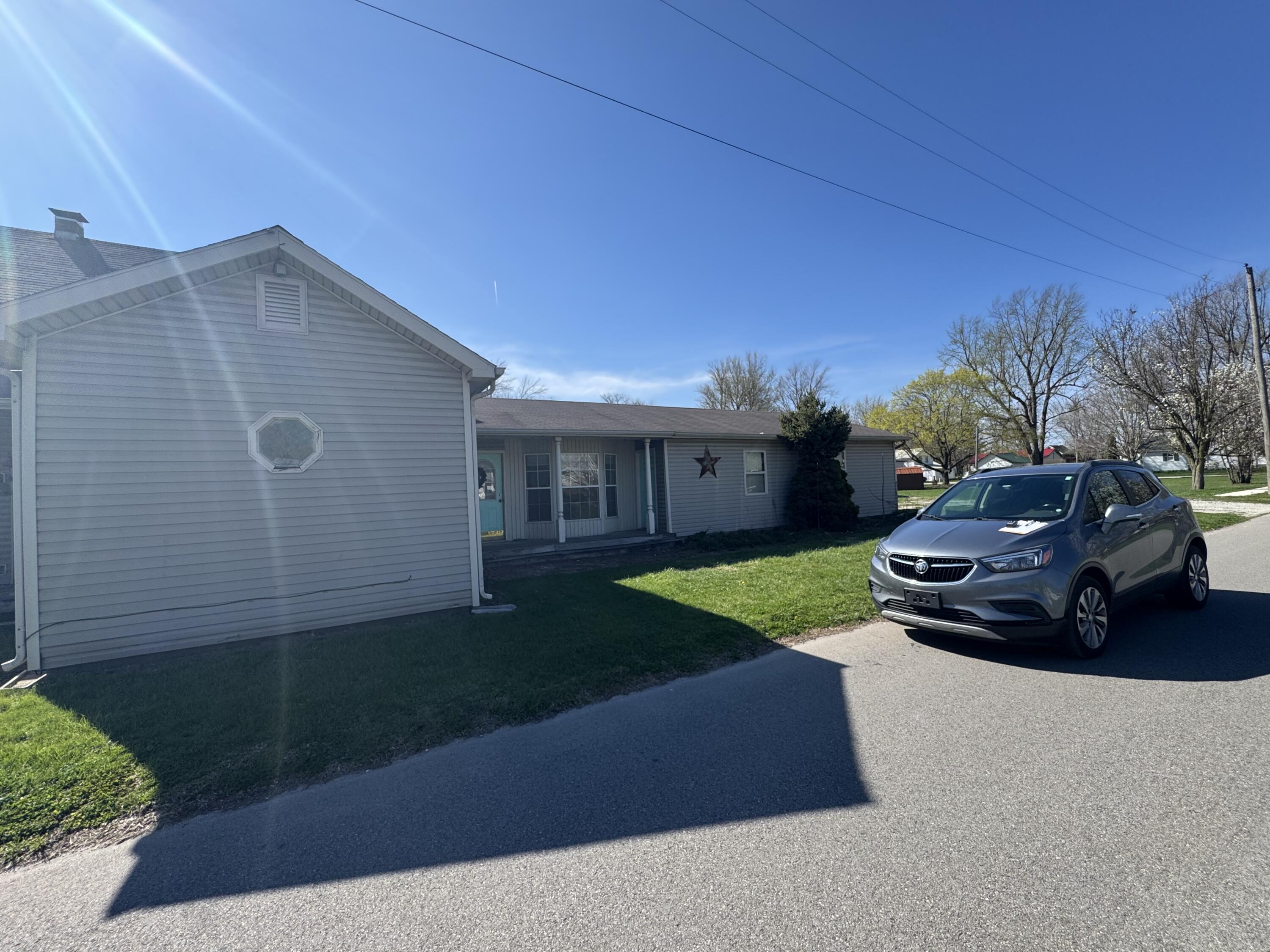 202 West Walnut Street Akron, IN 46910 - Photo 1 of 10 a car parked in front of a house
