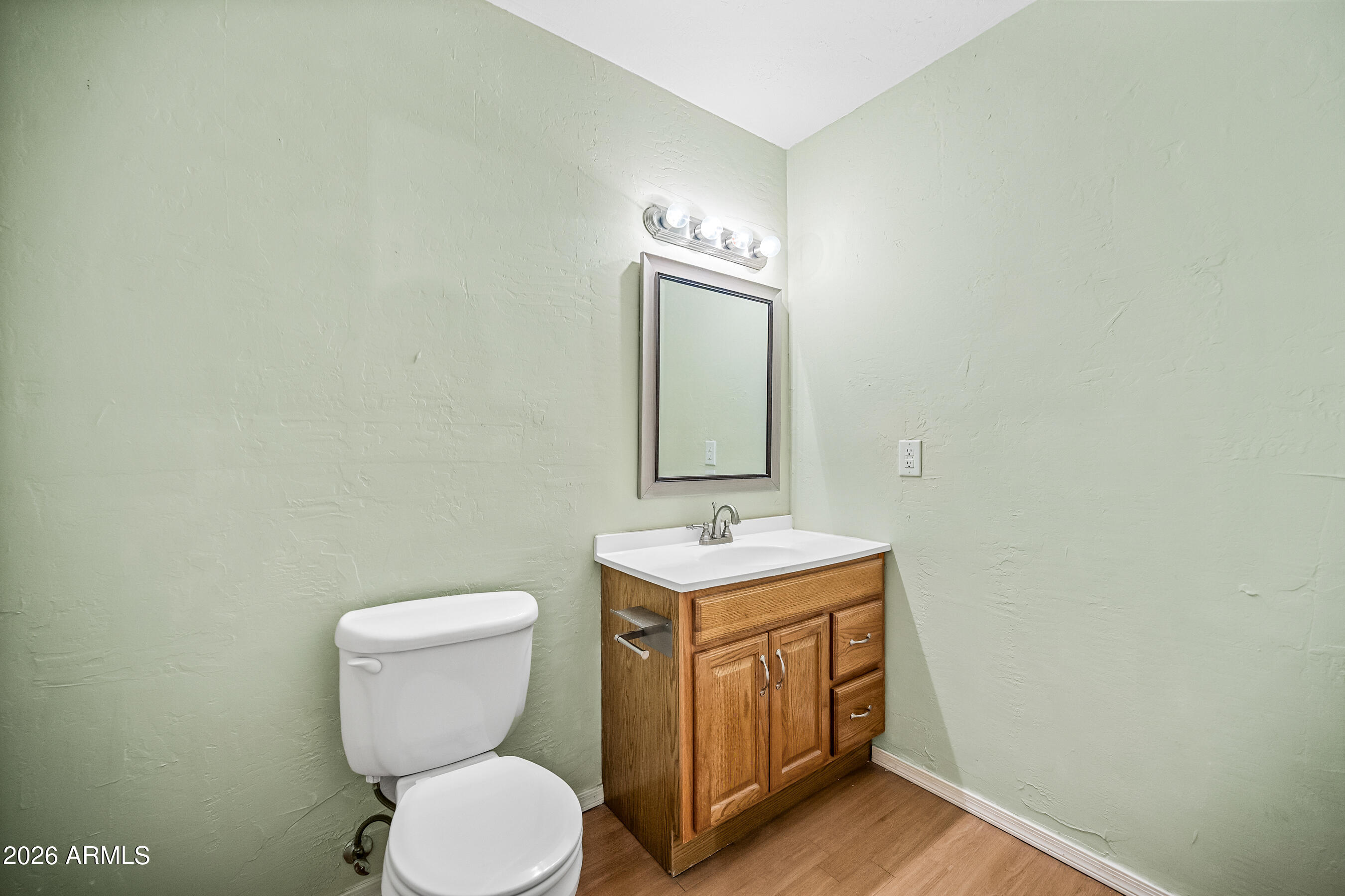 322 East Redfield Road Chandler, AZ 85225 - Photo 30 of 50 a bathroom with a toilet a sink and mirror