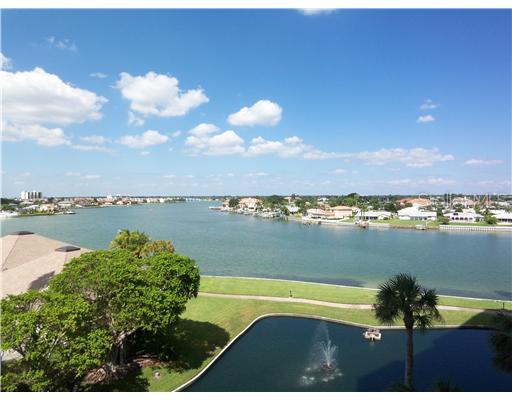 9425 Blind Pass Road, Unit 505 St. Pete Beach, FL 33706 - Photo 1 of 1 a view of a lake with a yard