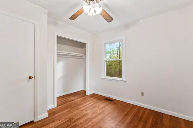 a view of a kitchen with a stove cabinets and a window