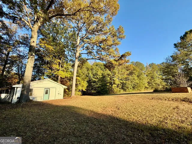a view of yard covered with snow