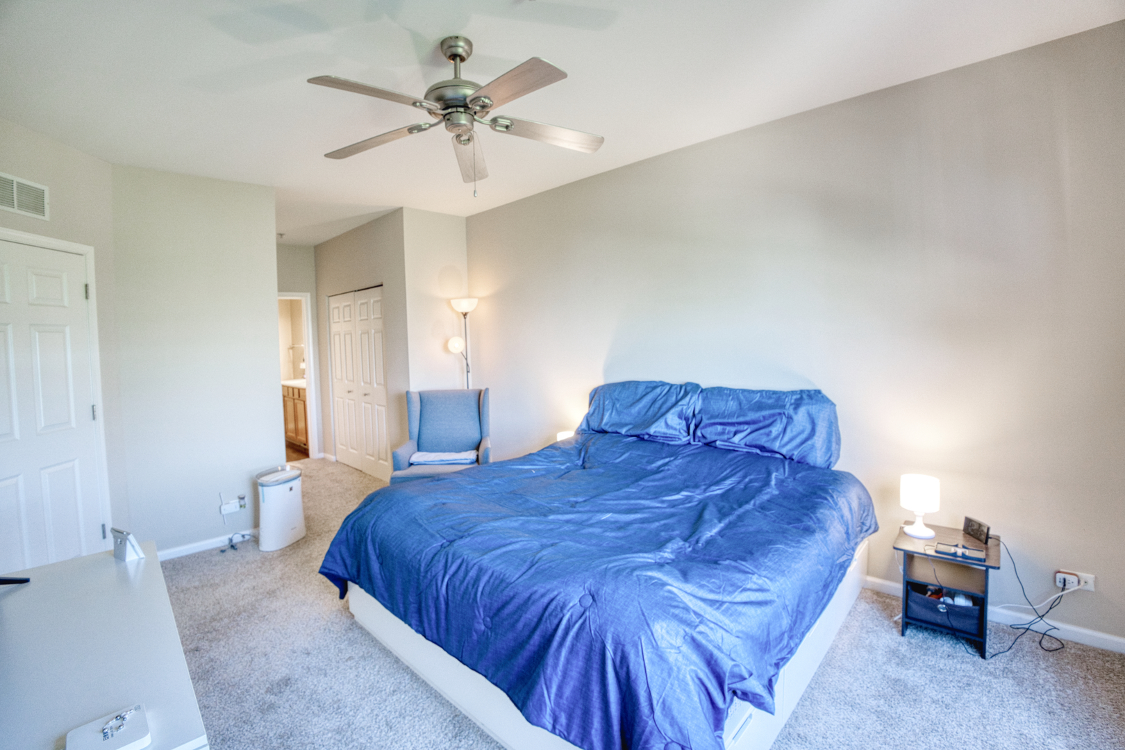 7520 Claridge Drive, Unit H Bridgeview, IL 60455 - Photo 13 of 22 a spacious bedroom with a bed and a chandelier