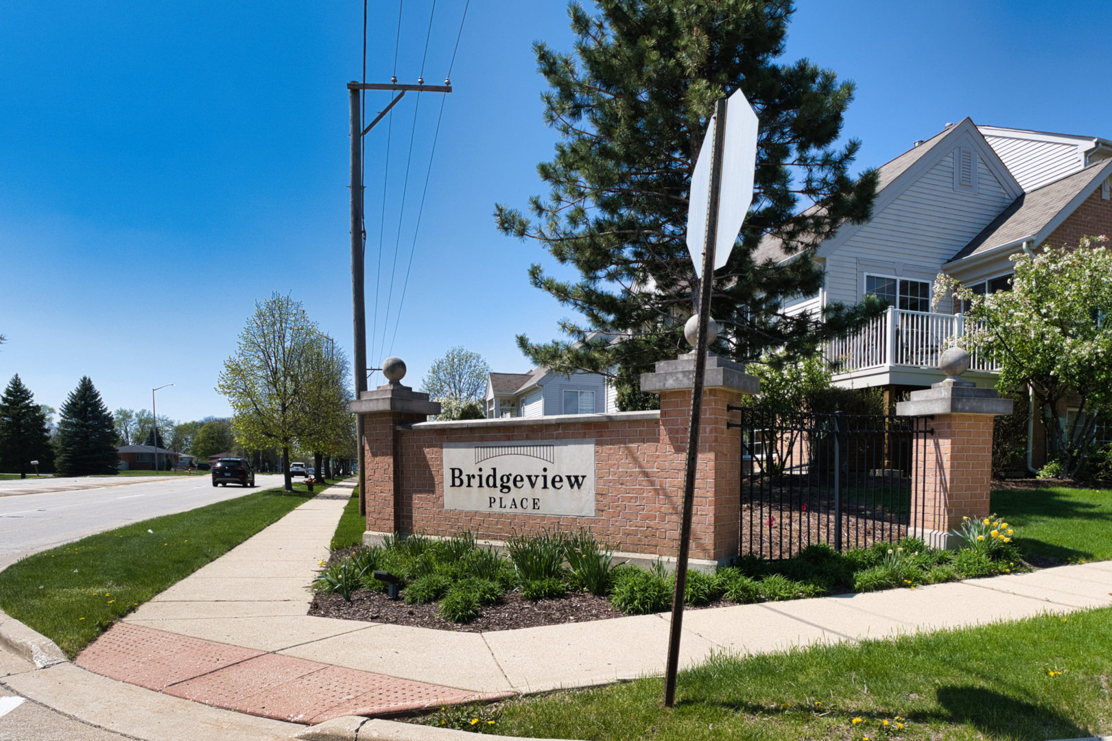 7520 Claridge Drive, Unit H Bridgeview, IL 60455 - Photo 2 of 22 a sign on the side of the building