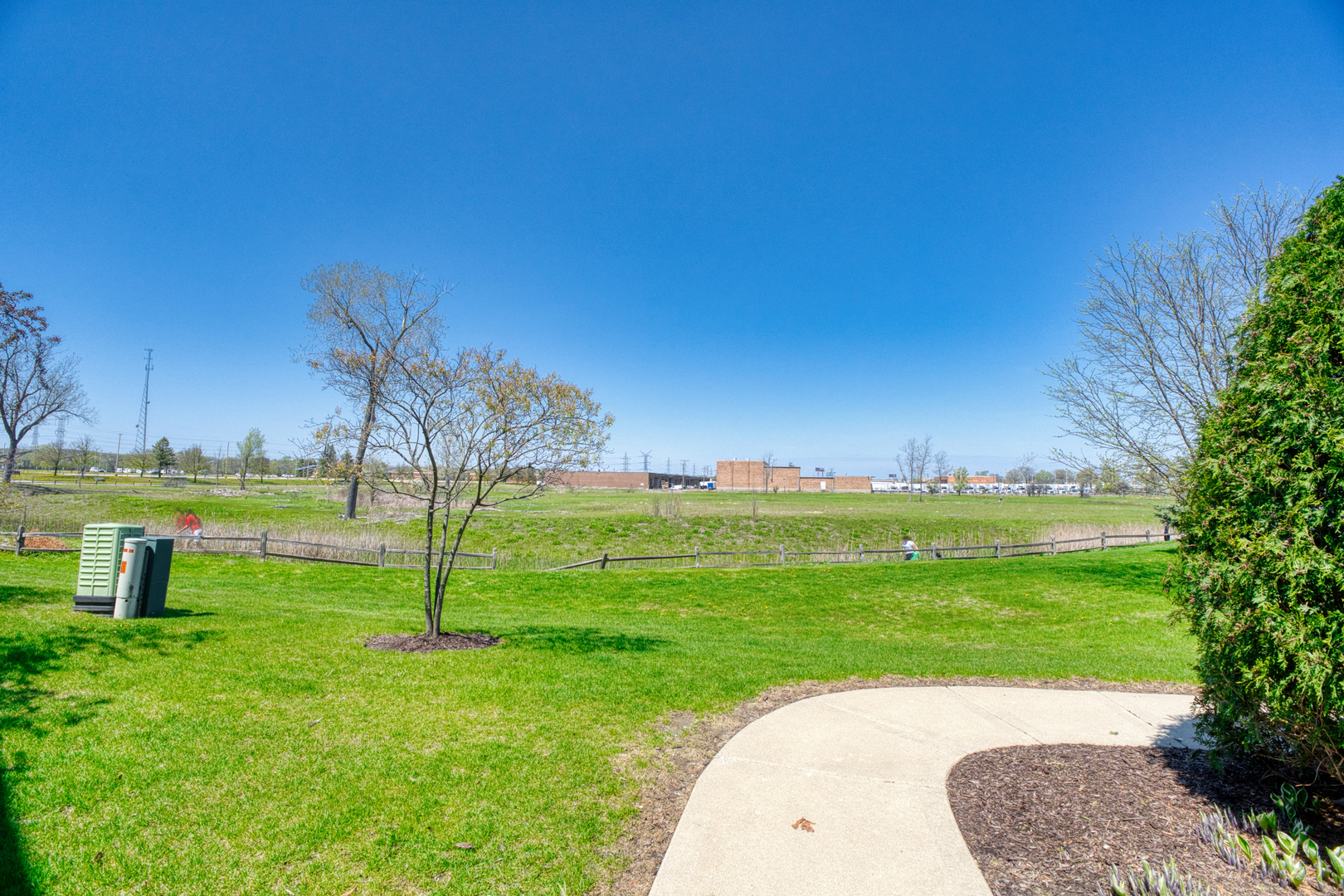 7520 Claridge Drive, Unit H Bridgeview, IL 60455 - Photo 22 of 22 a view of a golf course with a garden