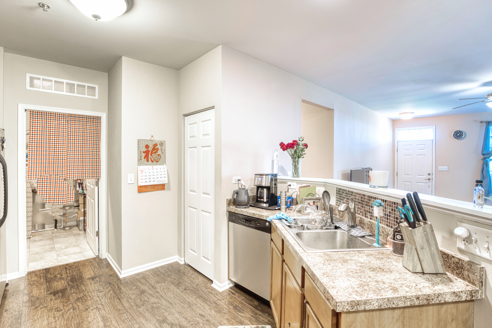 7520 Claridge Drive, Unit H Bridgeview, IL 60455 - Photo 7 of 22 a kitchen with granite countertop a sink stainless steel appliances and cabinets