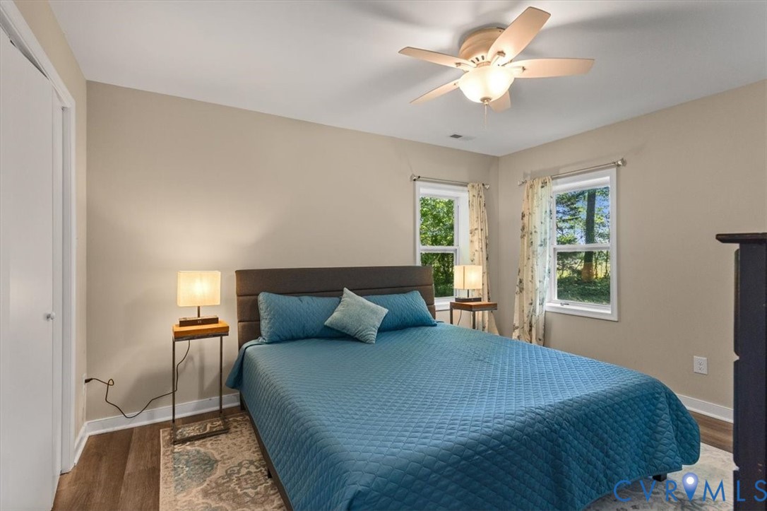 660 Johns Neck Road Weems, VA 22576 - Photo 19 of 65 Primary bedroom with king bed