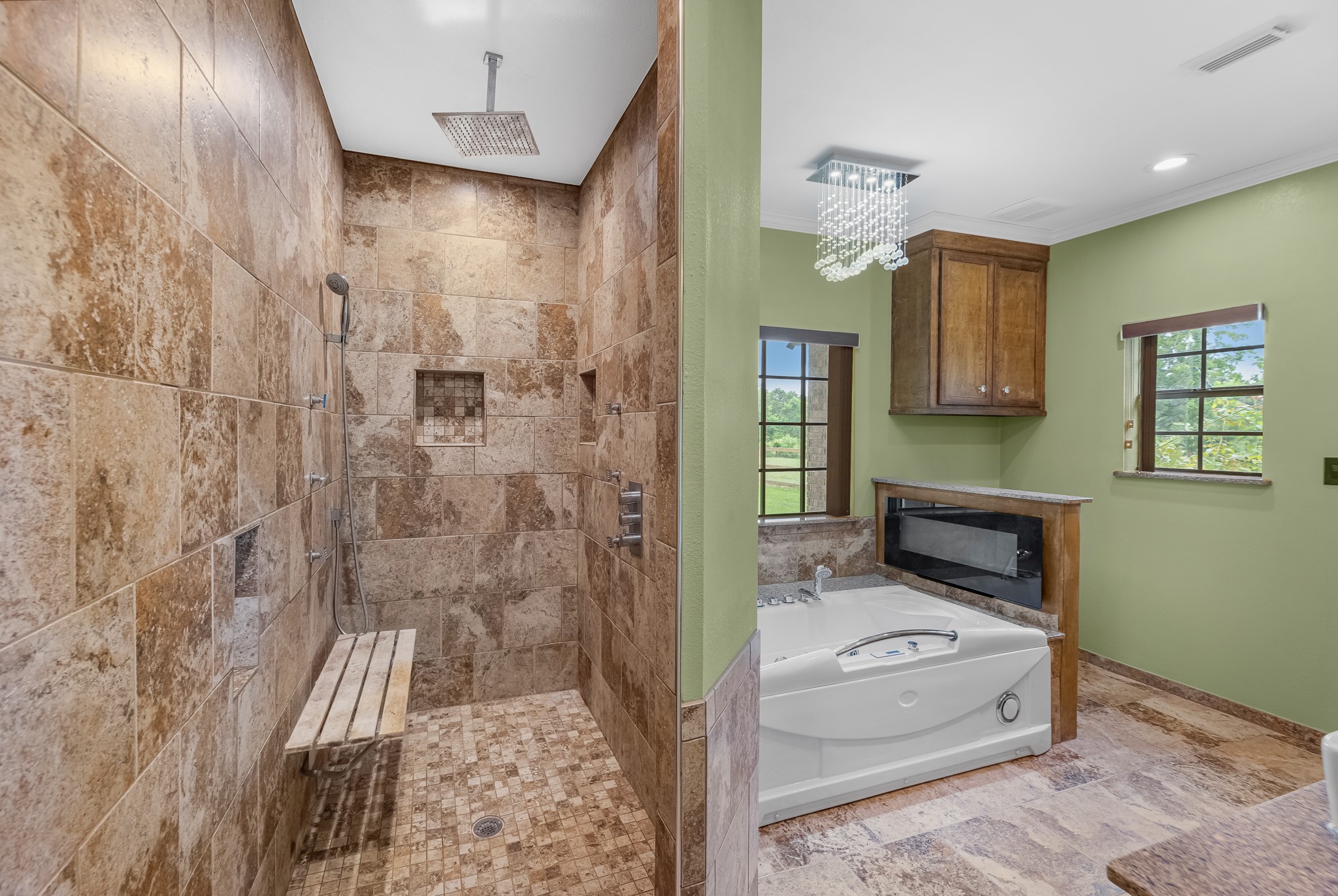 17126 County Road 39 Rosharon, TX 77583 - Photo 11 of 47 Enjoy a spa inspired 6 foot walk in shower tiled to ceiling. Rainshower, jets & handsprayer. Built in bench.