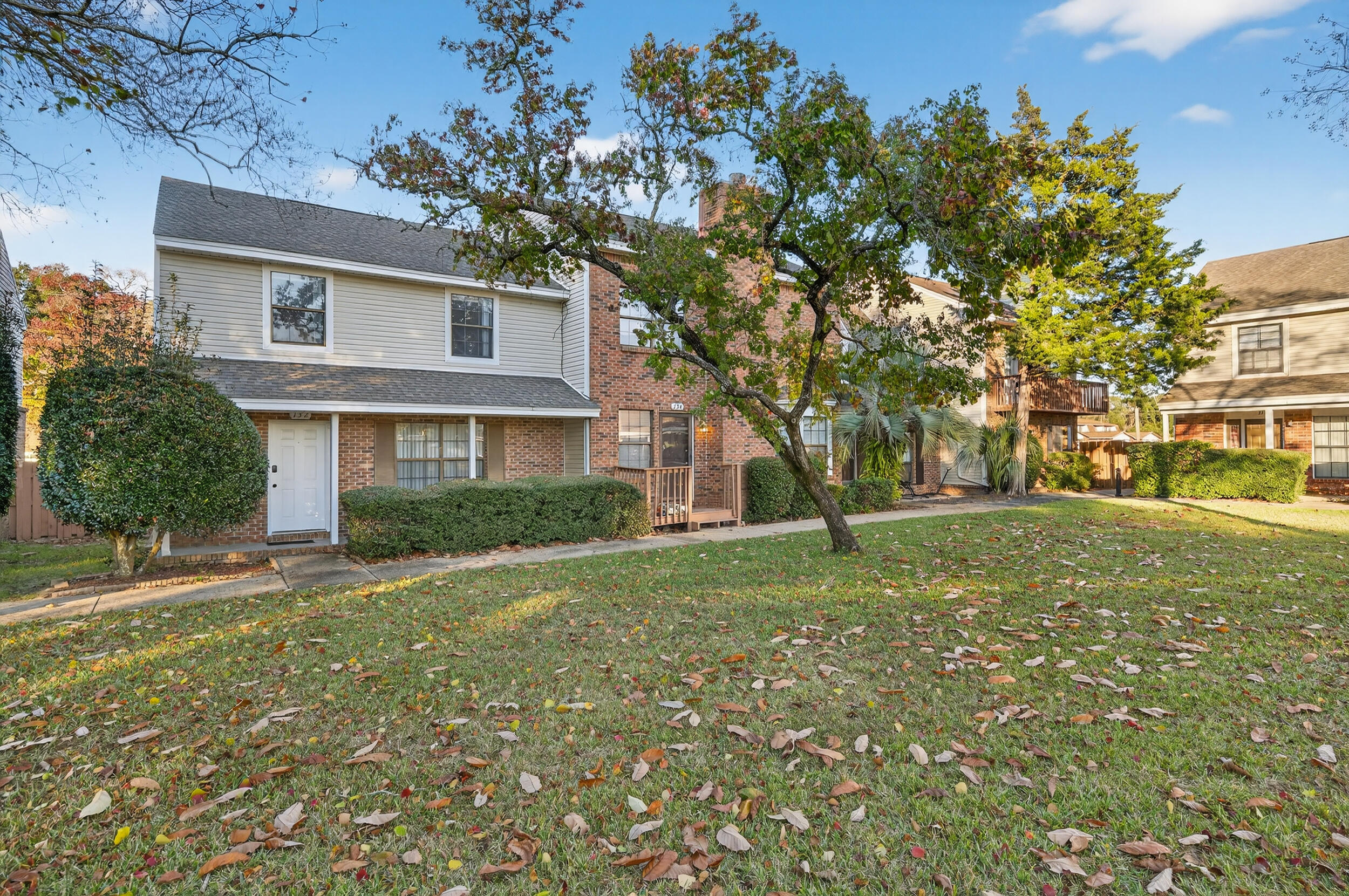 a view of a yard in front of a house