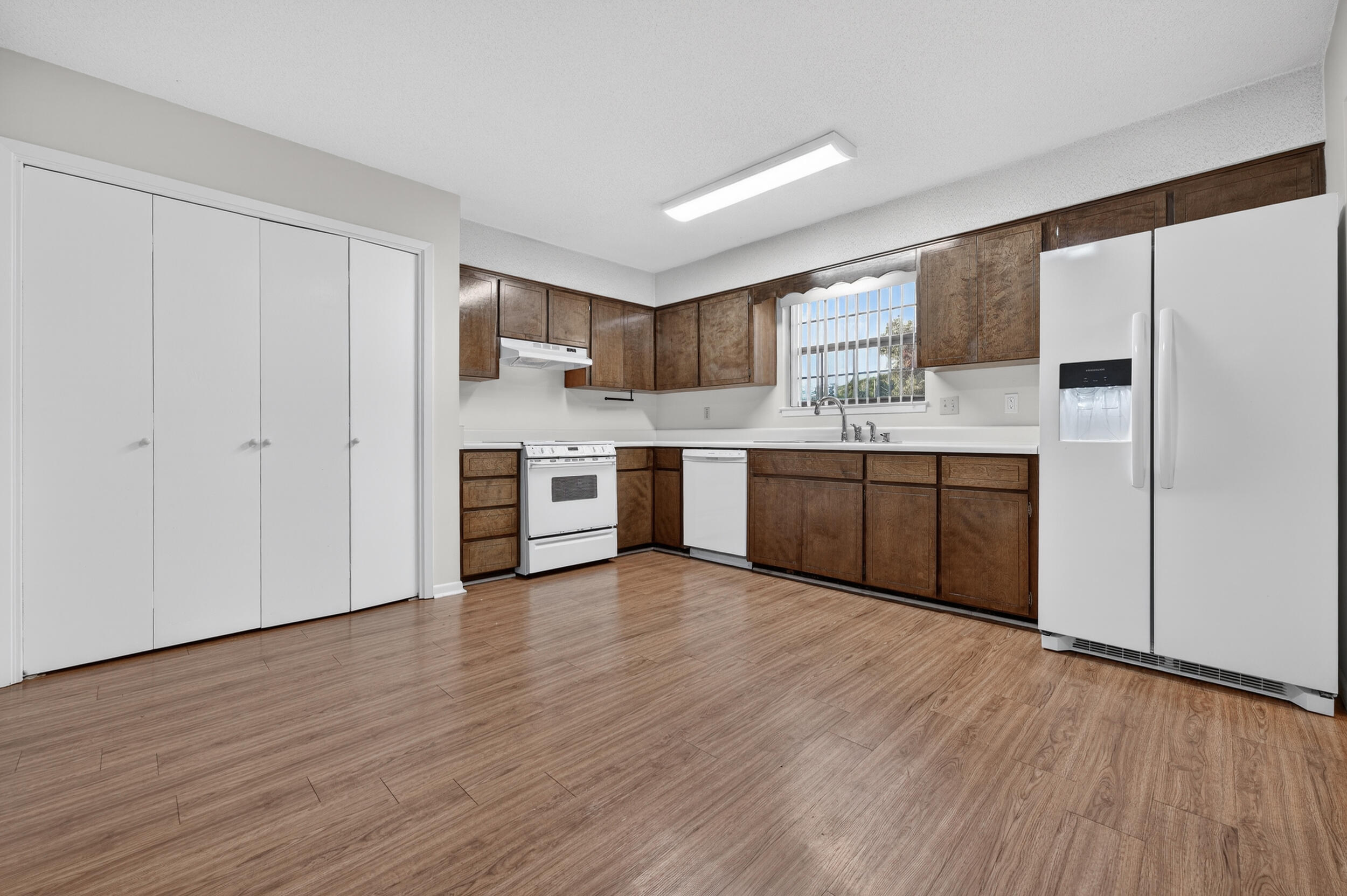 132 5th Avenue Shalimar, FL 32579 - Photo 11 of 39 a view of kitchen with stainless steel appliances granite countertop a stove top oven and sink