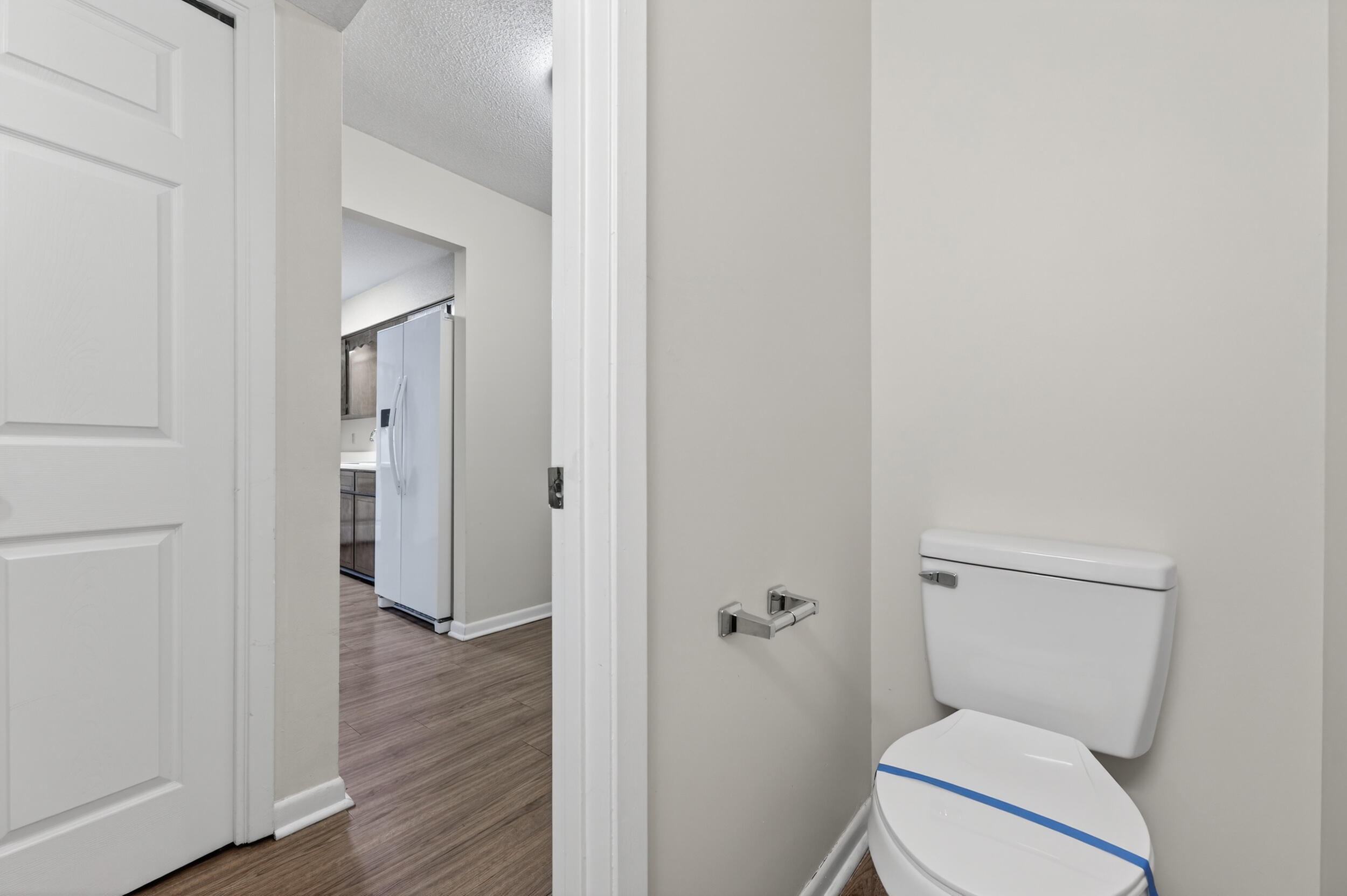 132 5th Avenue Shalimar, FL 32579 - Photo 14 of 39 a white toilet sitting next to a bathroom sink