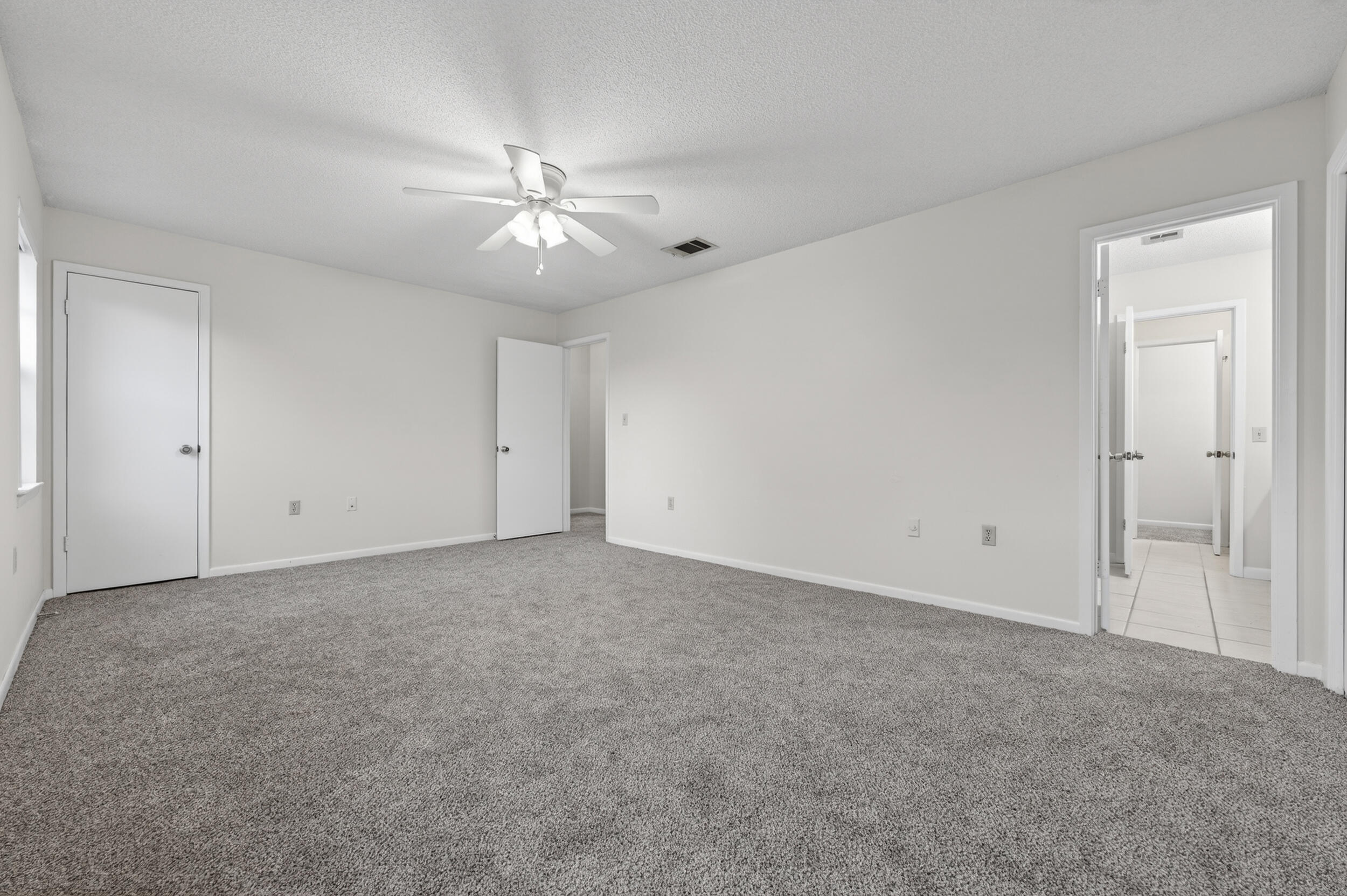 132 5th Avenue Shalimar, FL 32579 - Photo 18 of 39 a view of an empty room with a fan