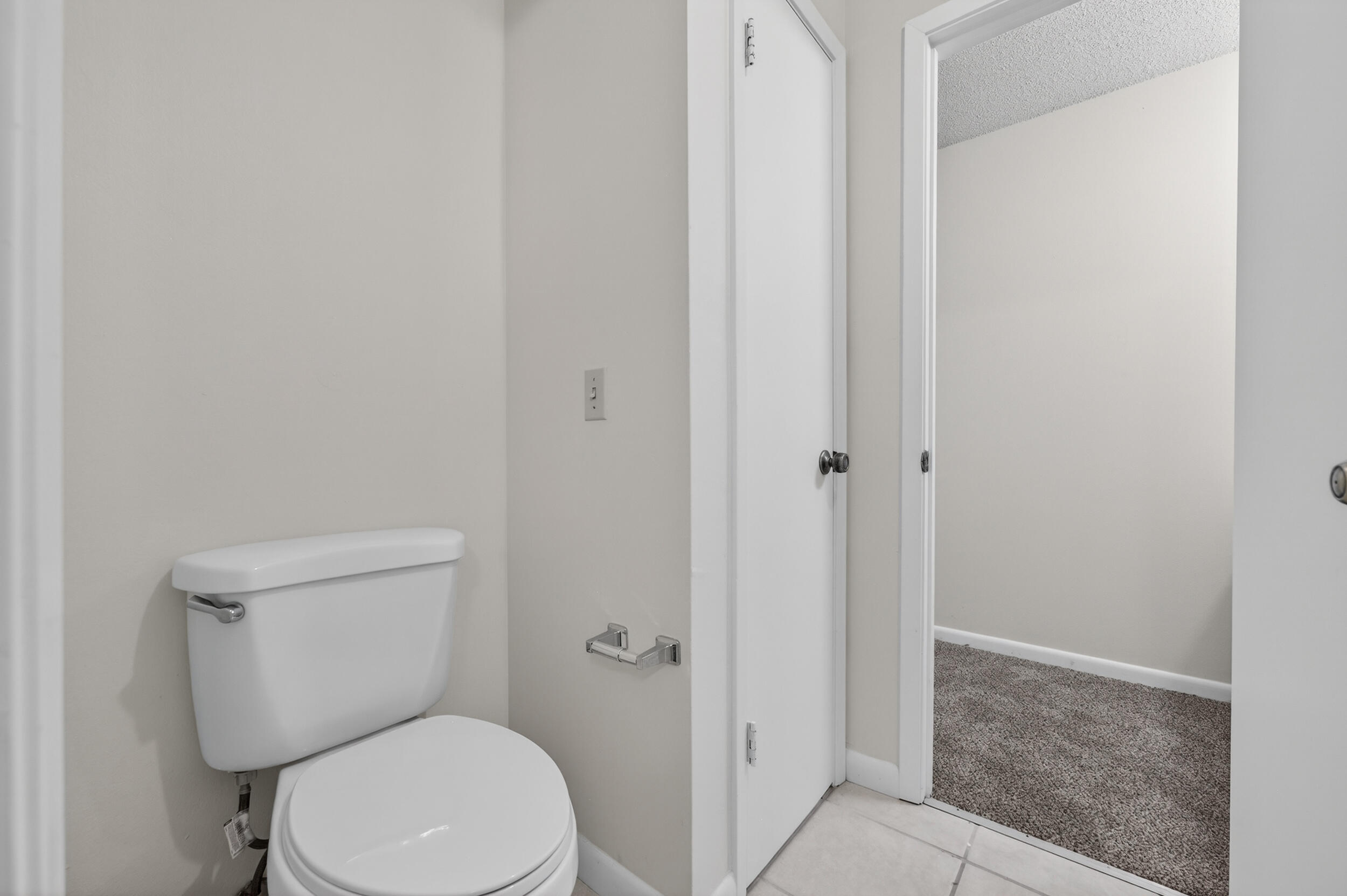 132 5th Avenue Shalimar, FL 32579 - Photo 25 of 39 a white toilet sitting next to a shower