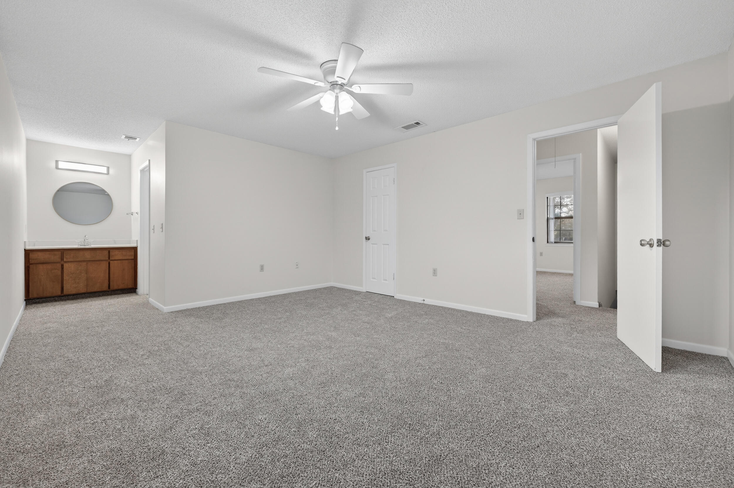 132 5th Avenue Shalimar, FL 32579 - Photo 29 of 39 a view of an empty room with chandelier fan